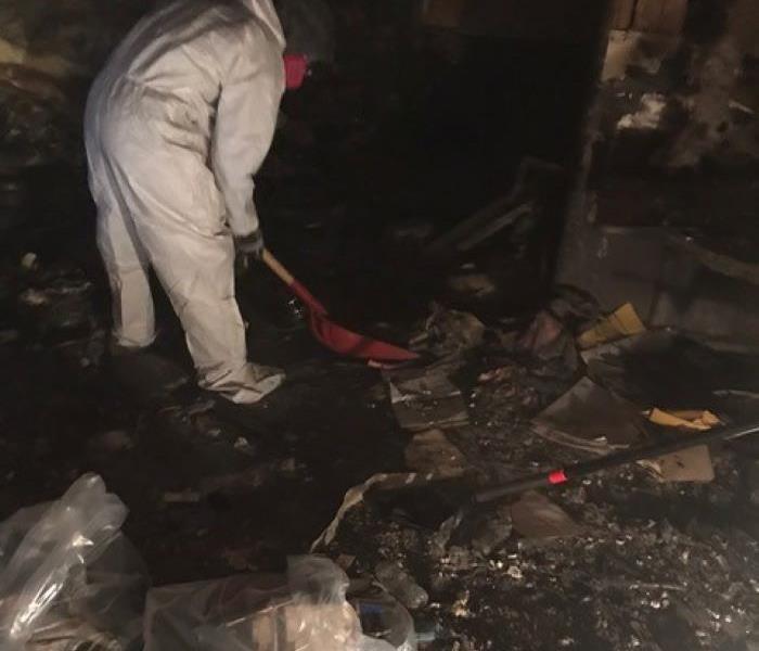 This pictures shows the basement of a home full of soot and debris before fire cleanup begins.
