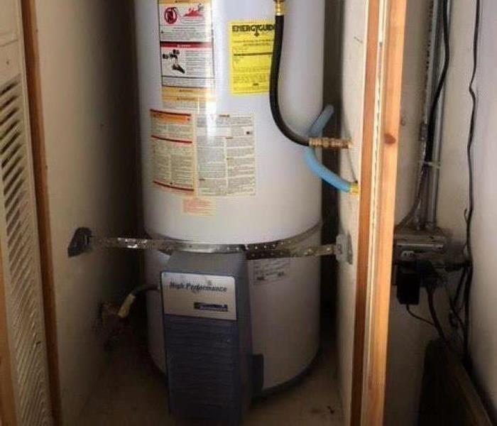Image shows a hot water tank in a garage